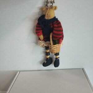 Moose Wearing Red & Black Striped Sweater and Black scarf Carrying Basket with B